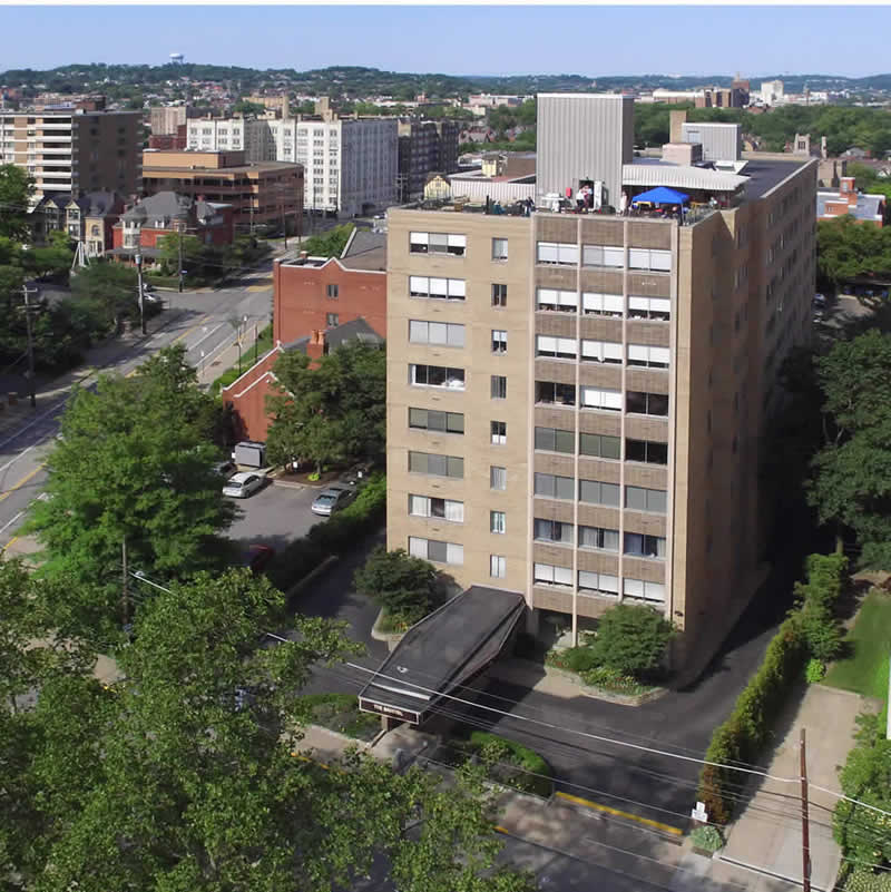 Aerial view of building and neighborhood